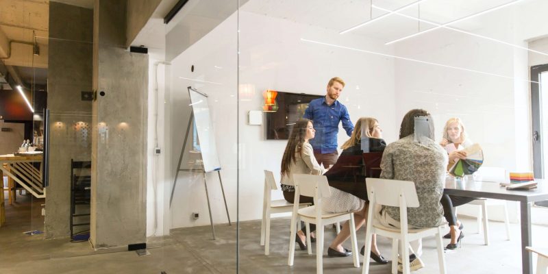 Multiracial modern business team developing the company's strate Multiethnic modern business team developing the company's strategy at the office